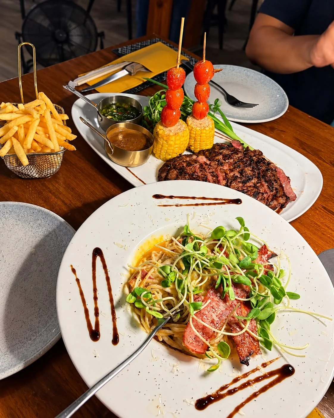 Real premium grilled beef and sides served at EAT Bar & Grill